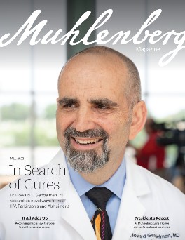 A magazine cover that says Muhlenberg Magazine with a photo of a doctor on the cover
