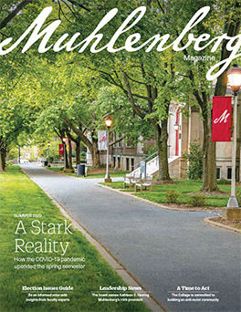 A magazine cover that says Muhlenberg Magazine with a photo of a deserted campus